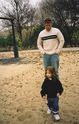 Daddy looking on as we roam through the park