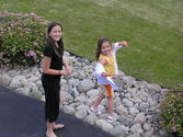 Kaija and Rebecca playing in the front yard