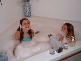 Kaija and Becca playing in Nana's jet tub