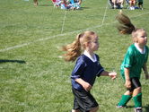 Kaija and a member of the opposing team trying to see who has the wildest hair