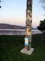 Kaija with a totem poll in Peachland at sunset