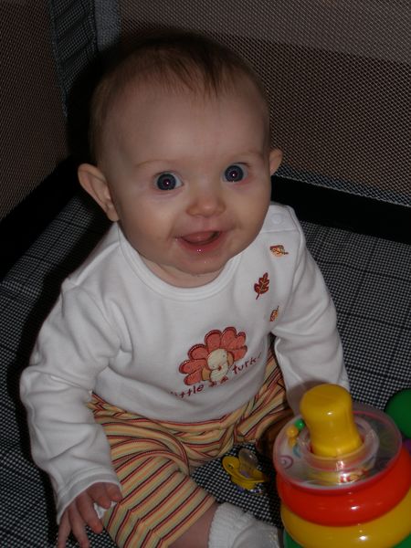 Playing with her toy that her big sister picked out
