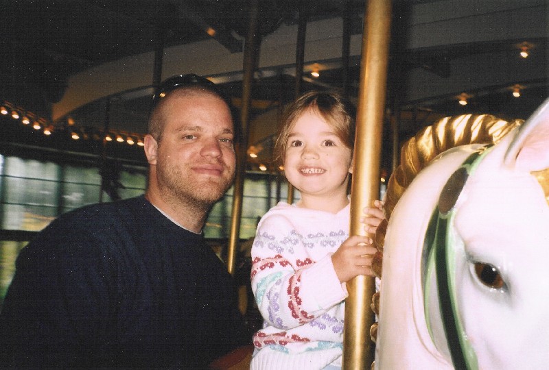 Kaija and Daddy riding the carousel
