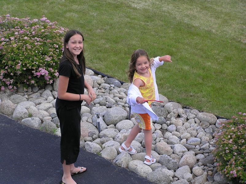 Kaija and Rebecca playing in the front yard

