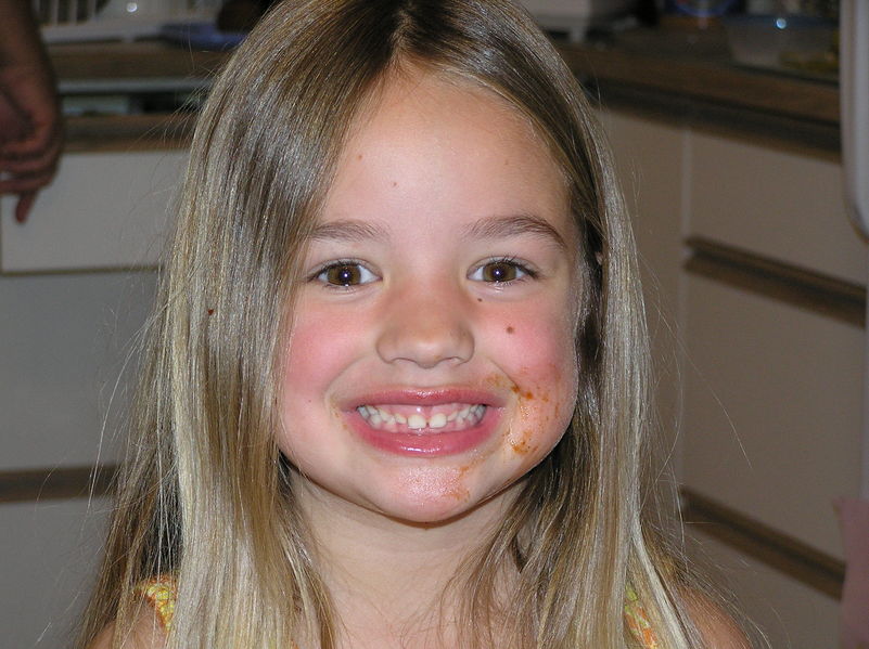 Kaija after demolishing a chicken leg that was covered in bbq sauce
