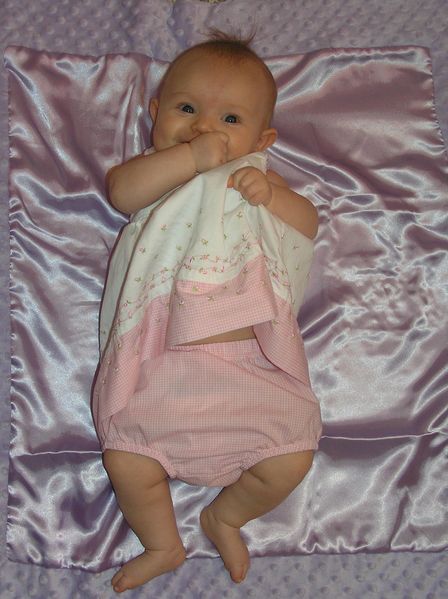 Maddi hiding behind her dress
