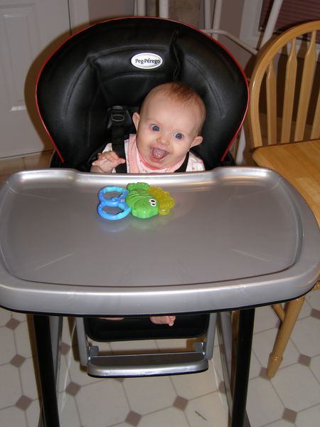 Maddi using a highchair for the very first time!
