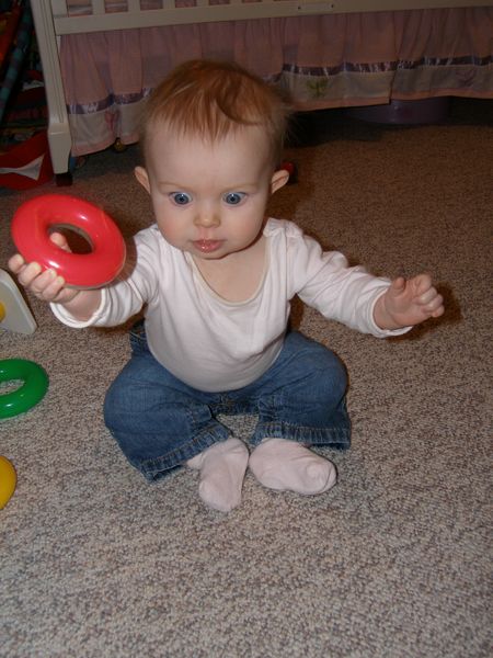 Playing with her ring stacker
