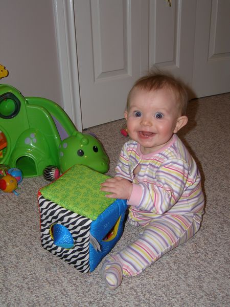 Playing with her shape sorter
