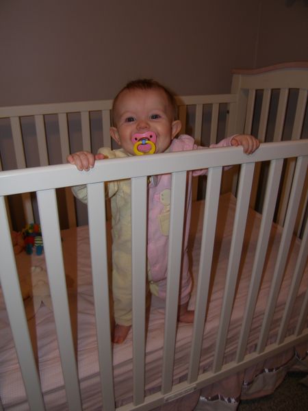 Standing, all by herself!  Yay Maddi!

