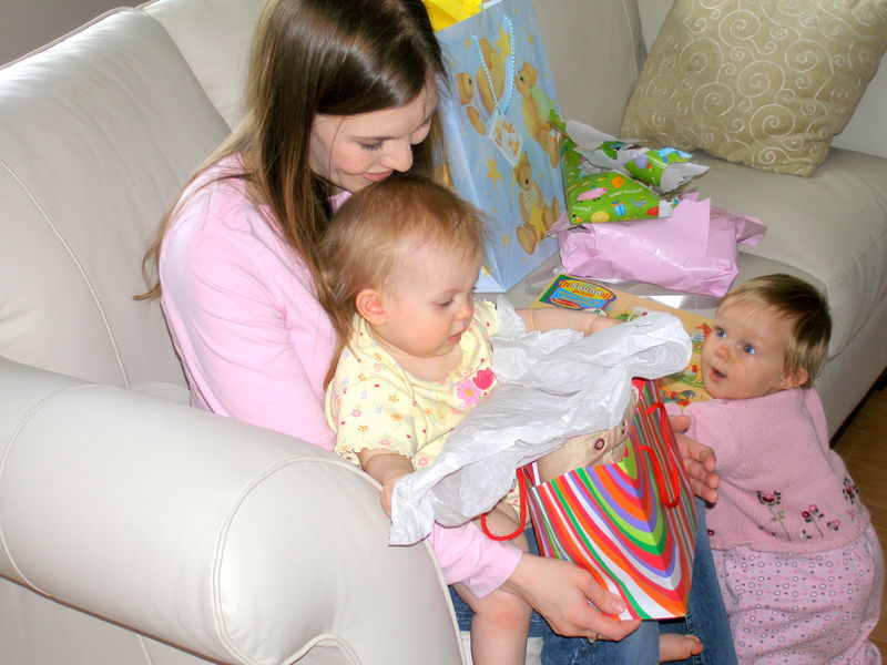 Opening gifts with Keira looking on
