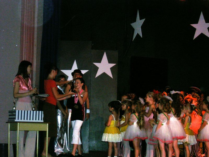 Rebecca receiving a trophy, her fourth award, but not a surprise as she is the outstanding dancer at her school
