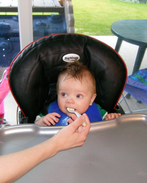 His very first bite of food ever!
