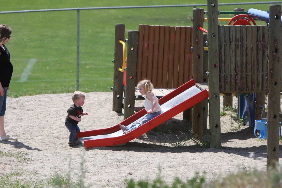 James waiting for Maddi at the bottom of the slide
