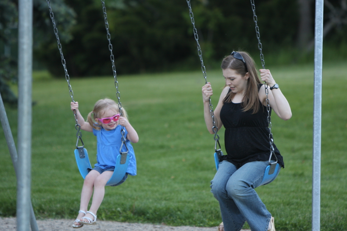 Mommy teaching Maddi how to swing
