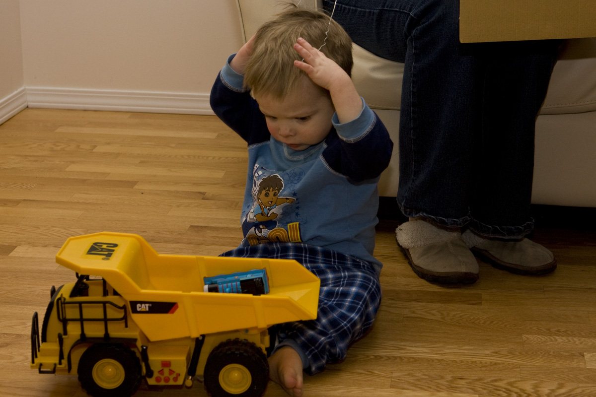 Putting a toy tie in his hair
