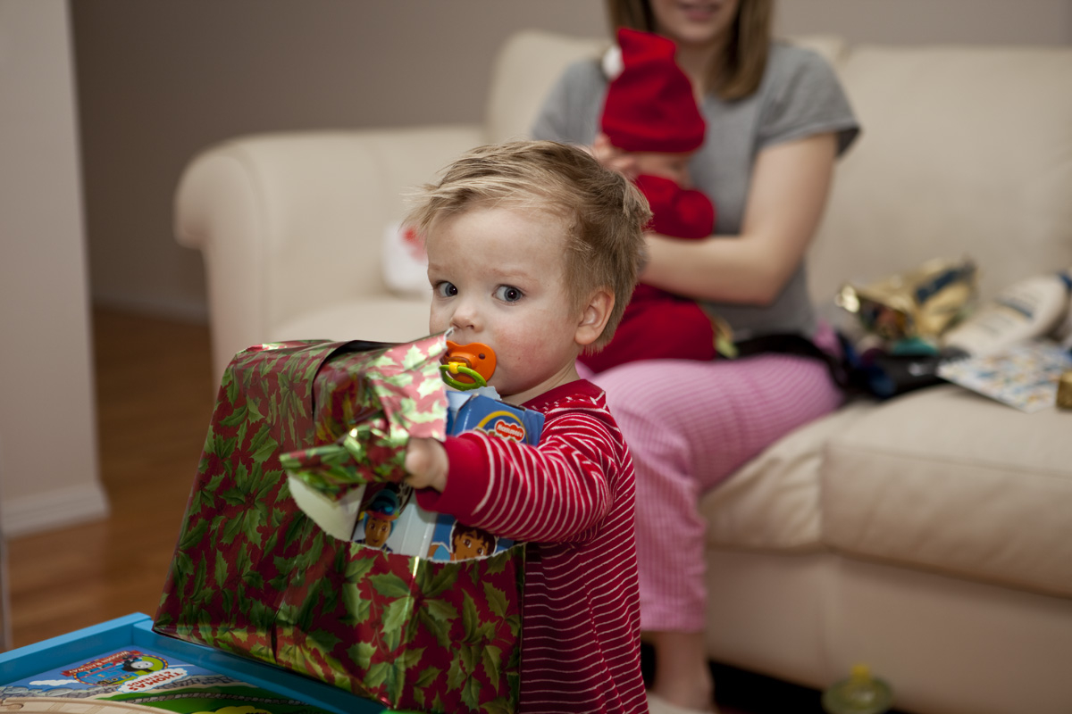 James unwrapping a Diego toy
