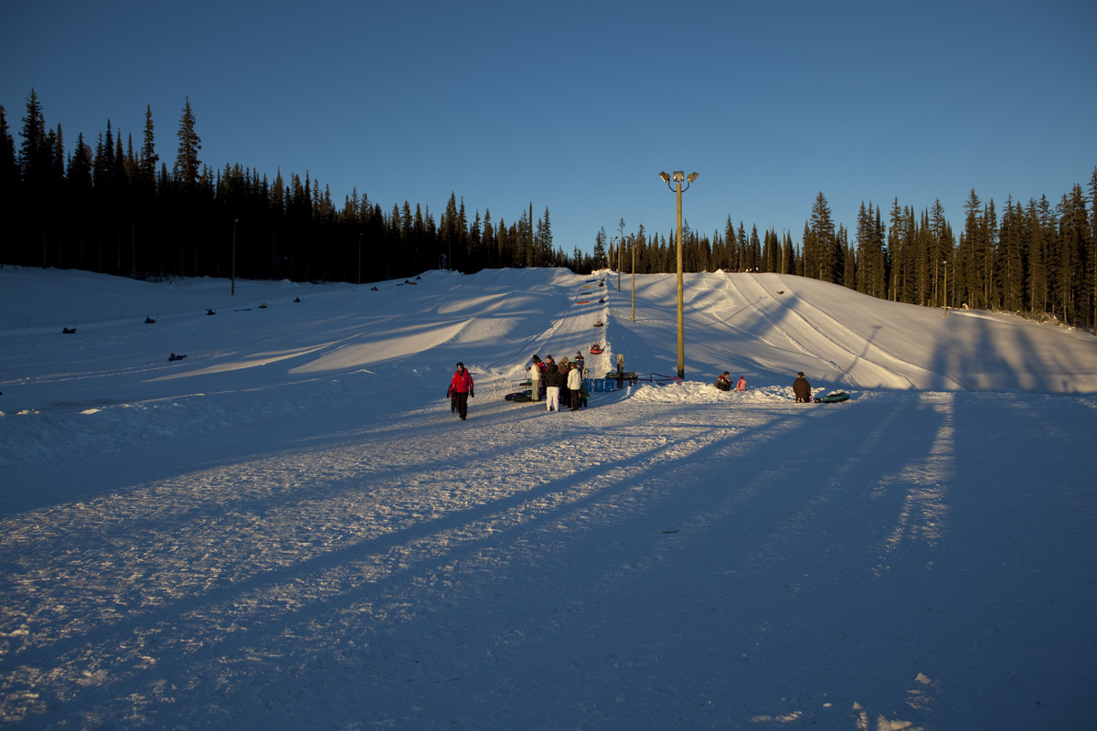 The sun is setting on the Big White tube park
