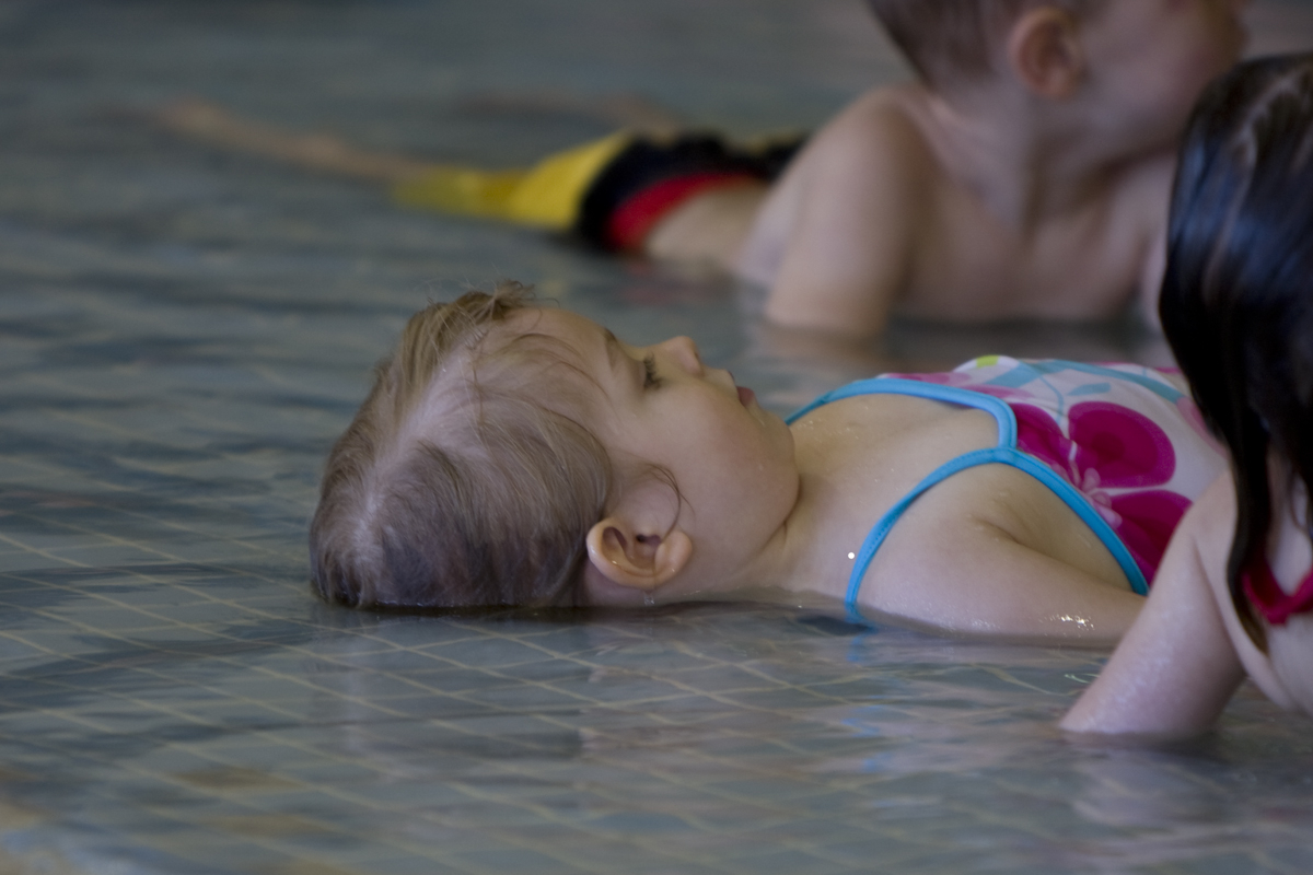 Maddux practicing floating on her back
