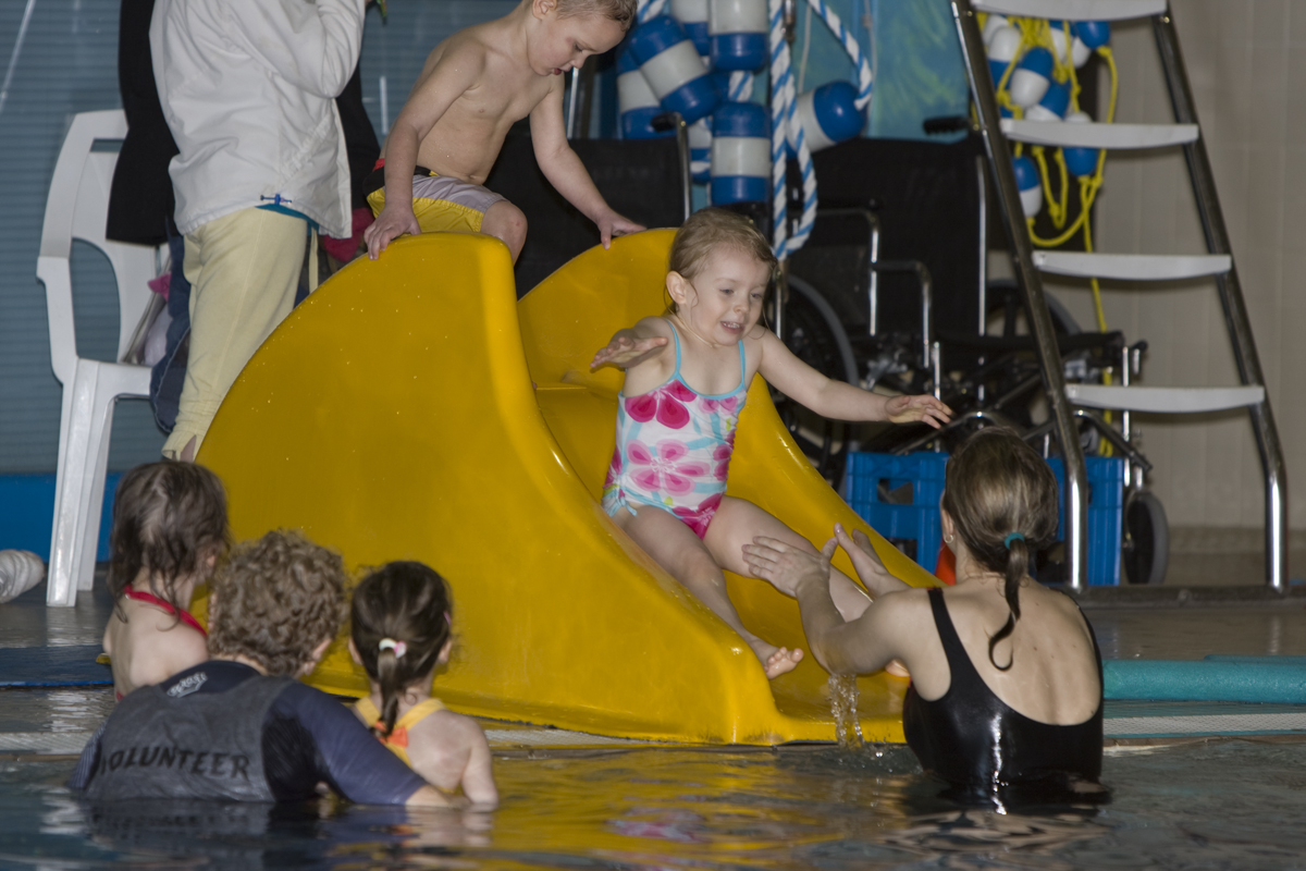 Maddux going down the slide
