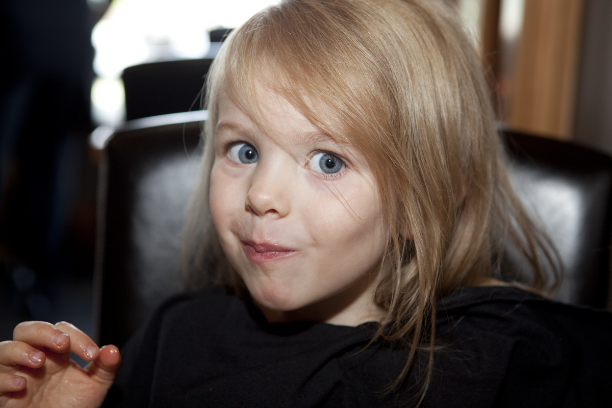 Maddi with a mouth full of yam fries and greasy fingers
