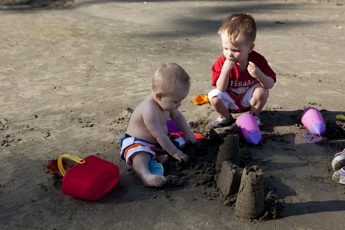 Thomas plots the demise of Maddi's sand castles

