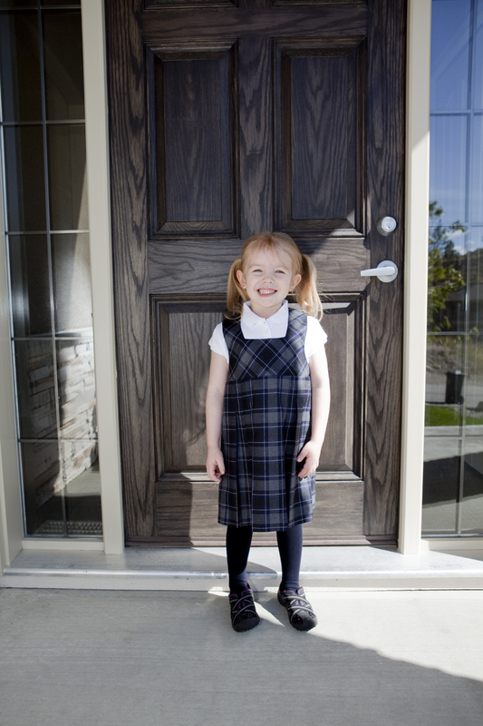 Leaving the house for her first day at her new school
