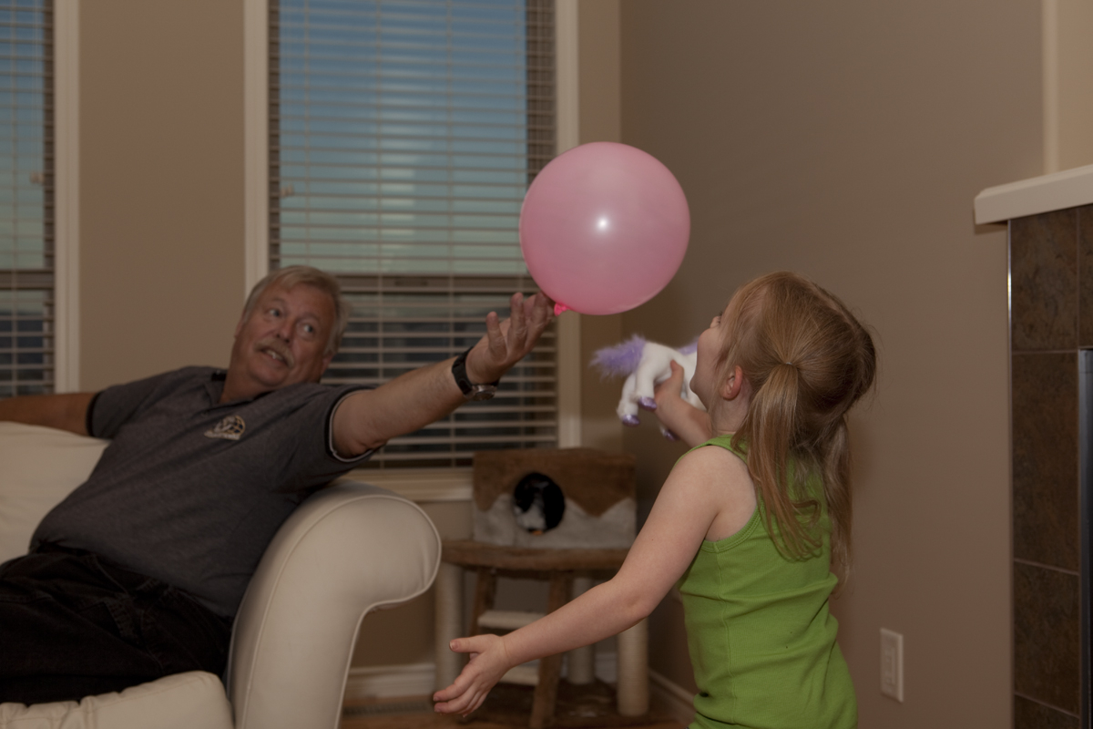 Poppa & Maddux playing with a balloon
